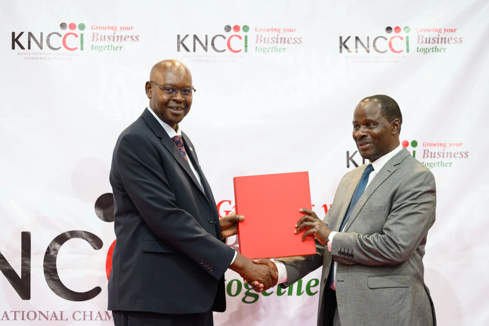 KNCCI President Dr Erick Rutto with Cyrell Wagunda Odede, Principal Secretary, State Department for Public Investments and Assets Management during the KNCCI AGM in Nairobi on Thursday.
