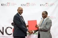 KNCCI President Dr Erick Rutto with Cyrell Wagunda Odede, Principal Secretary, State Department for Public Investments and Assets Management during the KNCCI AGM in Nairobi on Thursday.