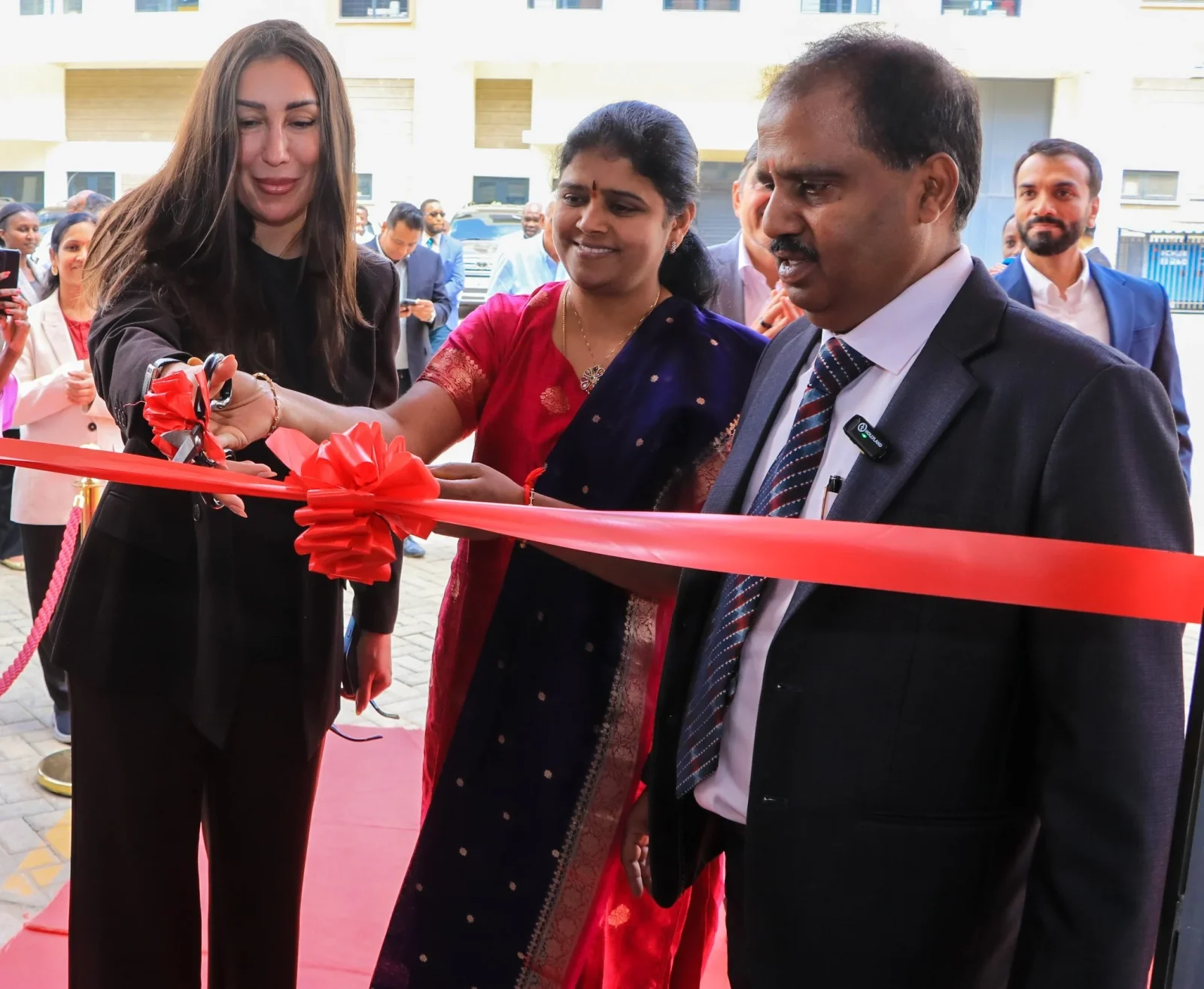 Ms. Afaf Kontar, Chief Executive Officer of AHI Carrier (right), joins Kishore Reddy, Managing Director of North Star Cooling Systems (left), in cutting a ribbon to officially unveil the first dealer-based Carrier and Toshiba HVAC showroom in Nairobi, launched in partnership with North Star Cooling Systems.