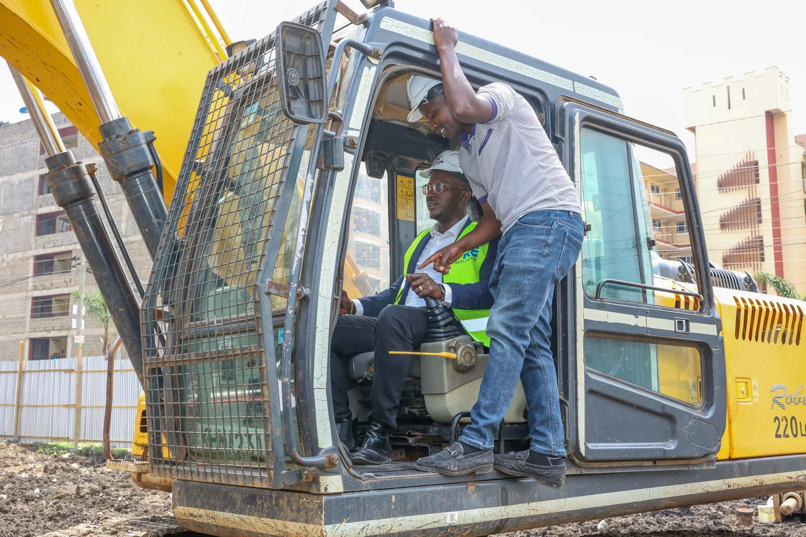 ERIC MULI, CEO MRE REAL ESTATE OPERATING THE EXCAVATOR DURING THE GROUND BREAKING CEREMONY OF MANYANJA MALL IN EASTLANDS.