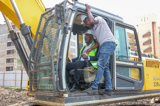 ERIC MULI, CEO MRE REAL ESTATE OPERATING THE EXCAVATOR DURING THE GROUND BREAKING CEREMONY OF MANYANJA MALL IN EASTLANDS.