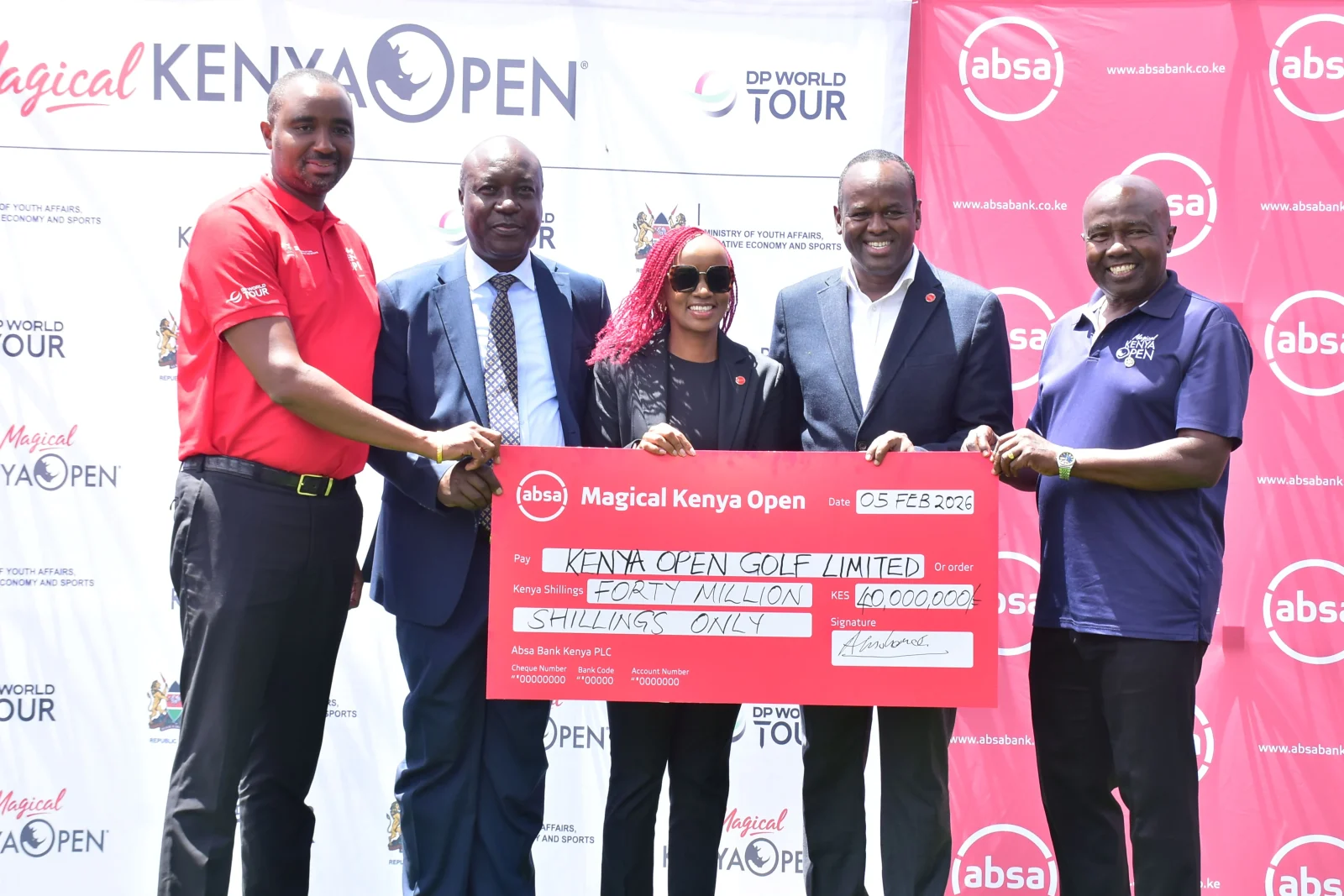 Absa Bank Kenya CEO Abdi Mohamed (2nd Right) and Marketing & Corporate Affairs Director Mwihaki Wachira (Centre) present the sponsorship cheque for Magical Kenya Open Patrick Obath(R)