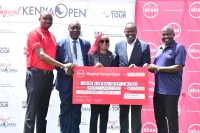 Absa Bank Kenya CEO Abdi Mohamed (2nd Right) and Marketing & Corporate Affairs Director Mwihaki Wachira (Centre) present the sponsorship cheque for Magical Kenya Open Patrick Obath(R)