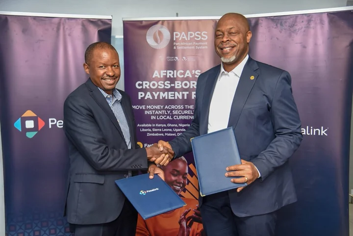 Gituku Kirika (left), CEO, Pesalink, and Mike Ogbalu (right), CEO, PAPSS, during the official partnership signing at IPSL offices in Nairobi, Kenya
