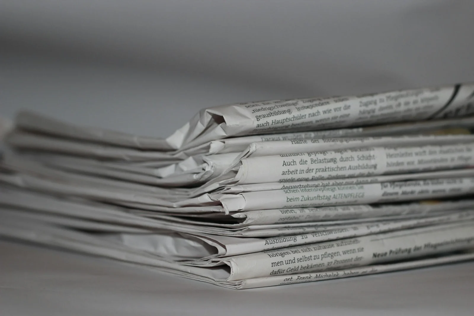 Folded newspapers.