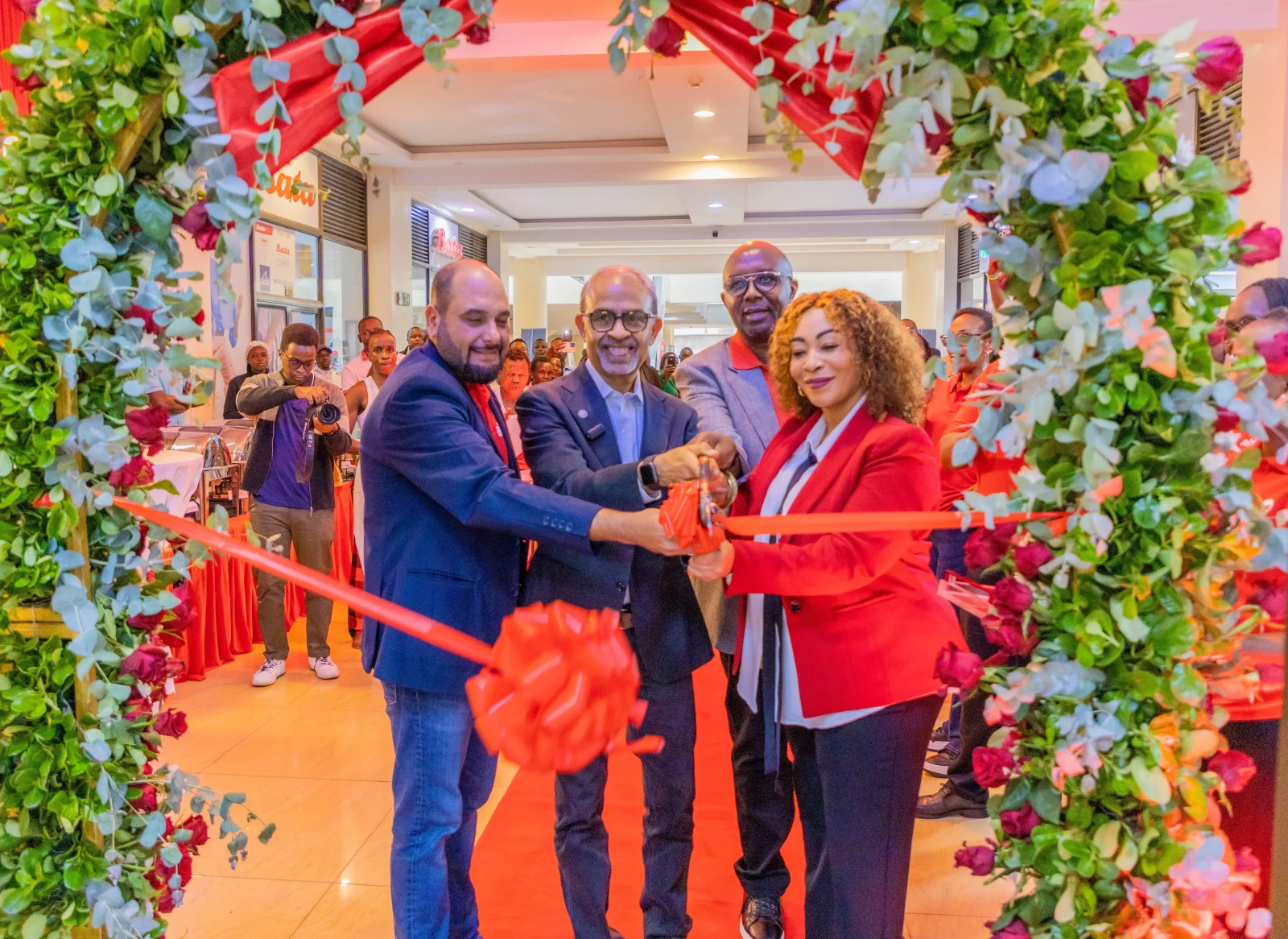 (L-R) Airtel Kenya MD Ashish Malhotra, Group CEO Sunil Taldar, Airtel Kenya Supply Chain Management Director Joseph Kariuki & Customer Experience Director Goldermier Opiyo, during the opening of a retail shop at Spur Mall, Ruiru, one of three new outlets opened to expand Airtel's footprint and bring services closer to customers.
