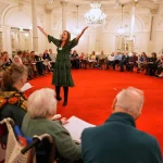 People, many of them seniors with a form of dementia, join in the "singing circle" run by opera singer Maartje de Lint, at the Concertgebouw's ornate Mirror Hall in Amsterdam on Feb. 24, 2026. (AP Photo/Peter Dejong) (ASSOCIATED PRESS)