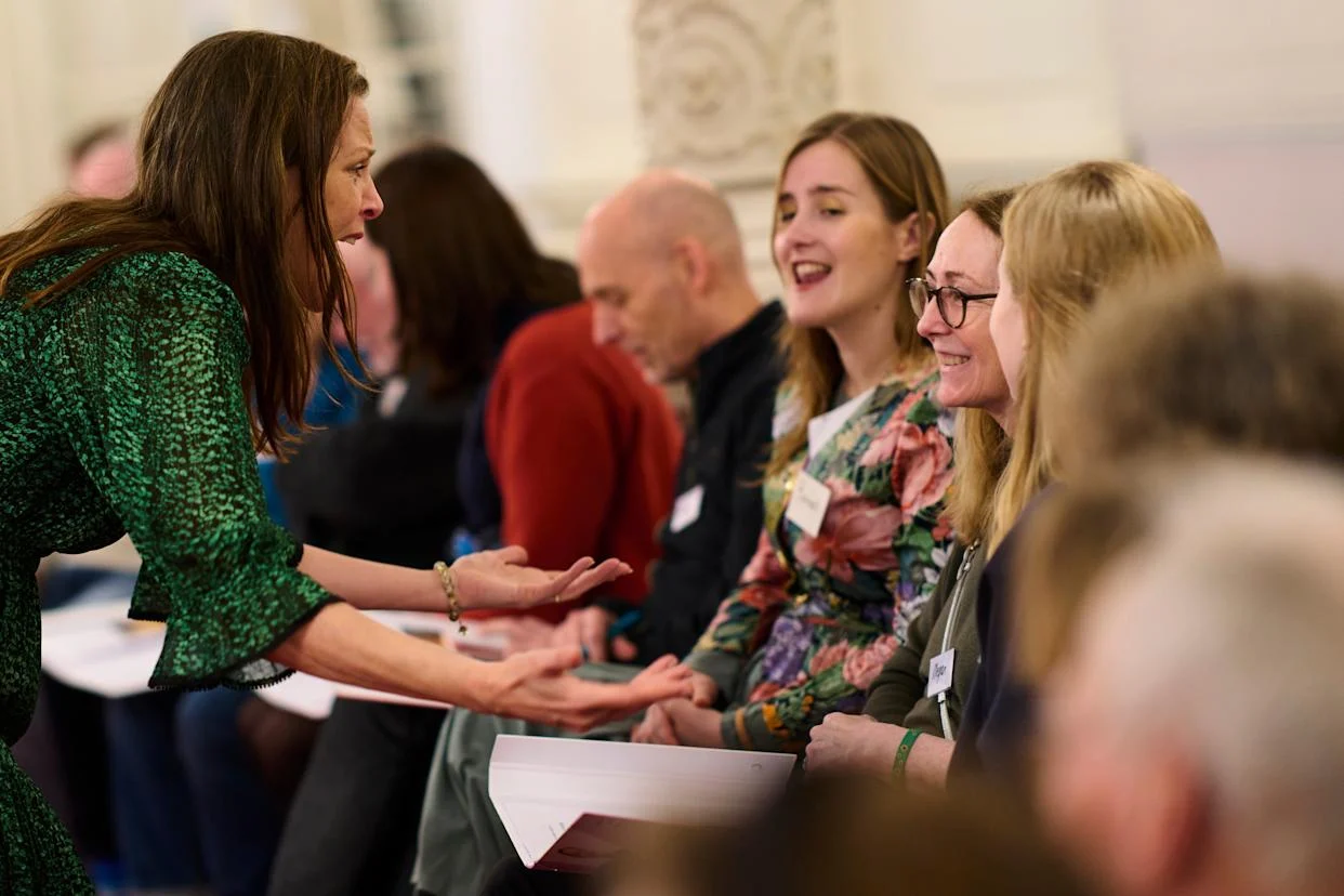 Megan Worthy, with glasses, right, and opera singer Maartje de Lint, left, and others, many of them seniors with a form of dementia, join in the "singing circle" at the Concertgebouw's ornate Mirror Hall in Amsterdam, on Feb. 24, 2026. (AP Photo/Peter Dejong) (ASSOCIATED PRESS)