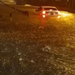 A car stuck in a flooded road