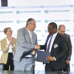 Omon Ukpoma-Olaiya, Regional Investment Team Lead (East & Southern Africa & Arab States) at the United Nations Capital Development Fund (UNCDF) and Vincent Marangu, Director Co-operatives Banking Division, C