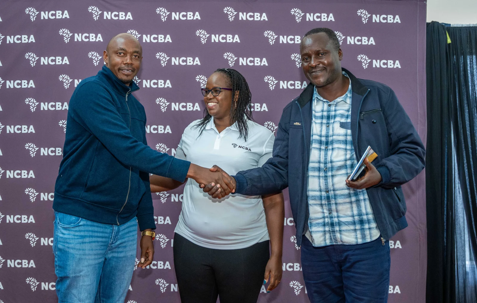 Shadrack kisiero, Seed Maize Farmer Trans Nzoia(left), Susan Ndungu Head, SME Banking NCBA and Wilson Saina, Production Officer, Kenya Seed