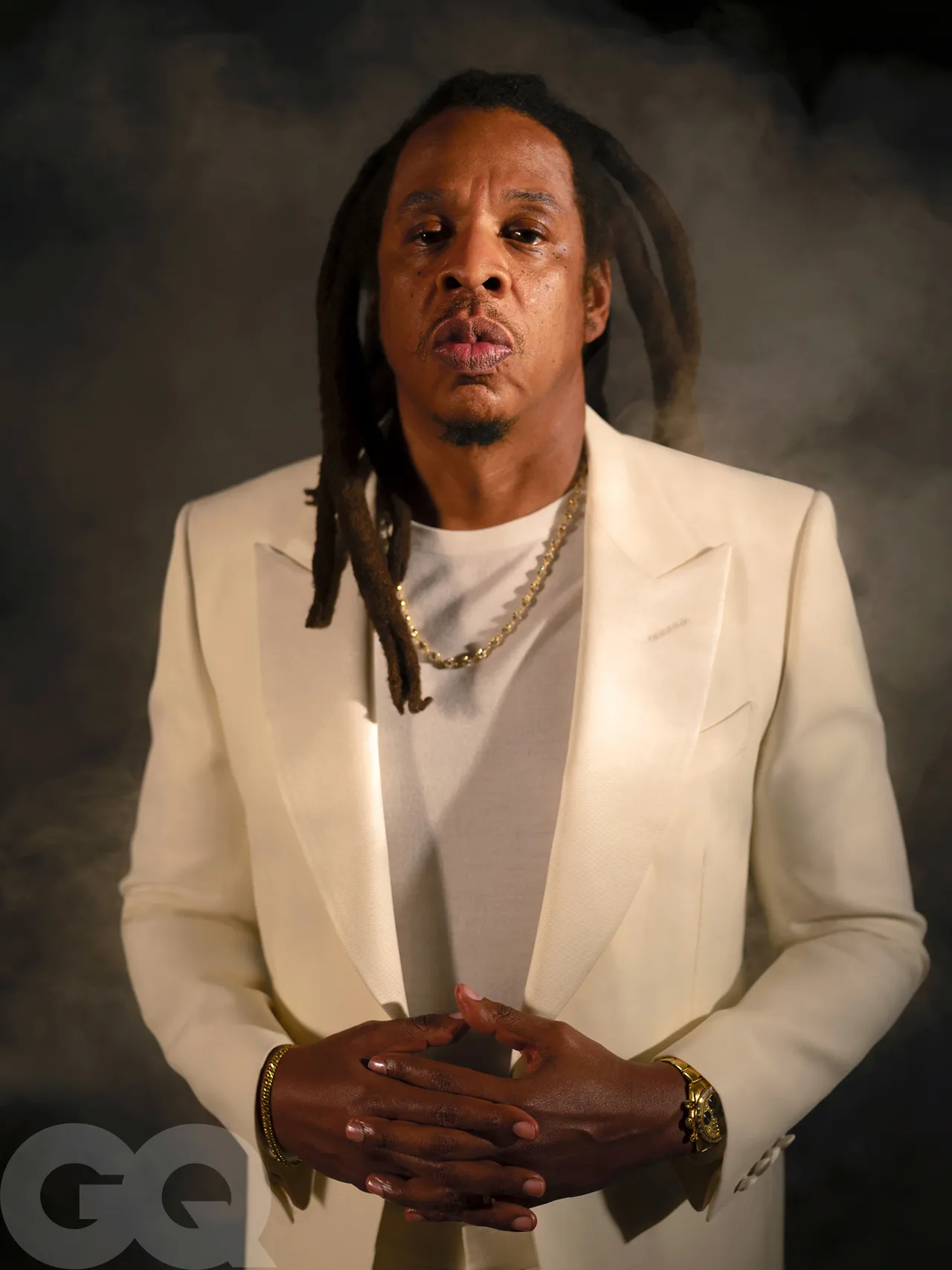 Jacket and pants by Tom Ford. Sweater by Zegna. His own watch by Rolex. Necklace by Maggi Simpkins. Bracelet, stylists’ own.