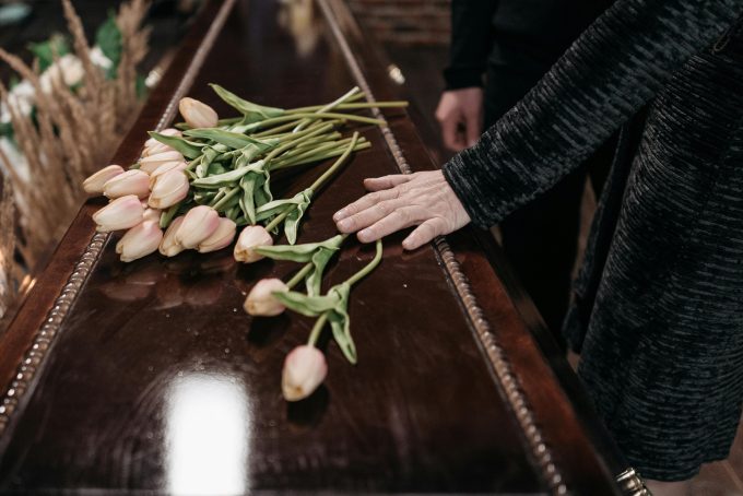 A casket with flowers on top