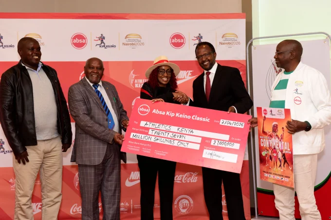 Absa Bank Kenya Marketing and Corporate Affairs Director Mwihaki Wachira (Centre) presents the sponsorship cheque Competition Director Kennedy Tanui, Vice President Jinaro Kibet (2nd Right), Competition Director Kennedy Tanui, Senior Vice President Paul Mutwii, and Meet Director Barnabas Korir during the Absa Kip Keino Classic