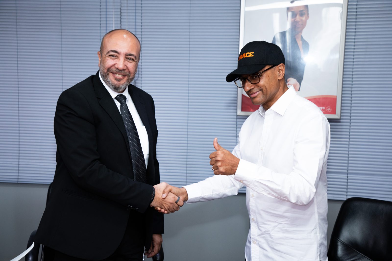 KQ AG CEO Capt. George Kamal and Trace Executive Chairman Olivier Laouchez shake hands following the signing of an MoU ahead of the Africa Forward Concert, marking a partnership focused on advancing African creativity, culture and connectivity.