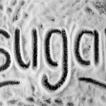 The word 'sugar' written in powder,