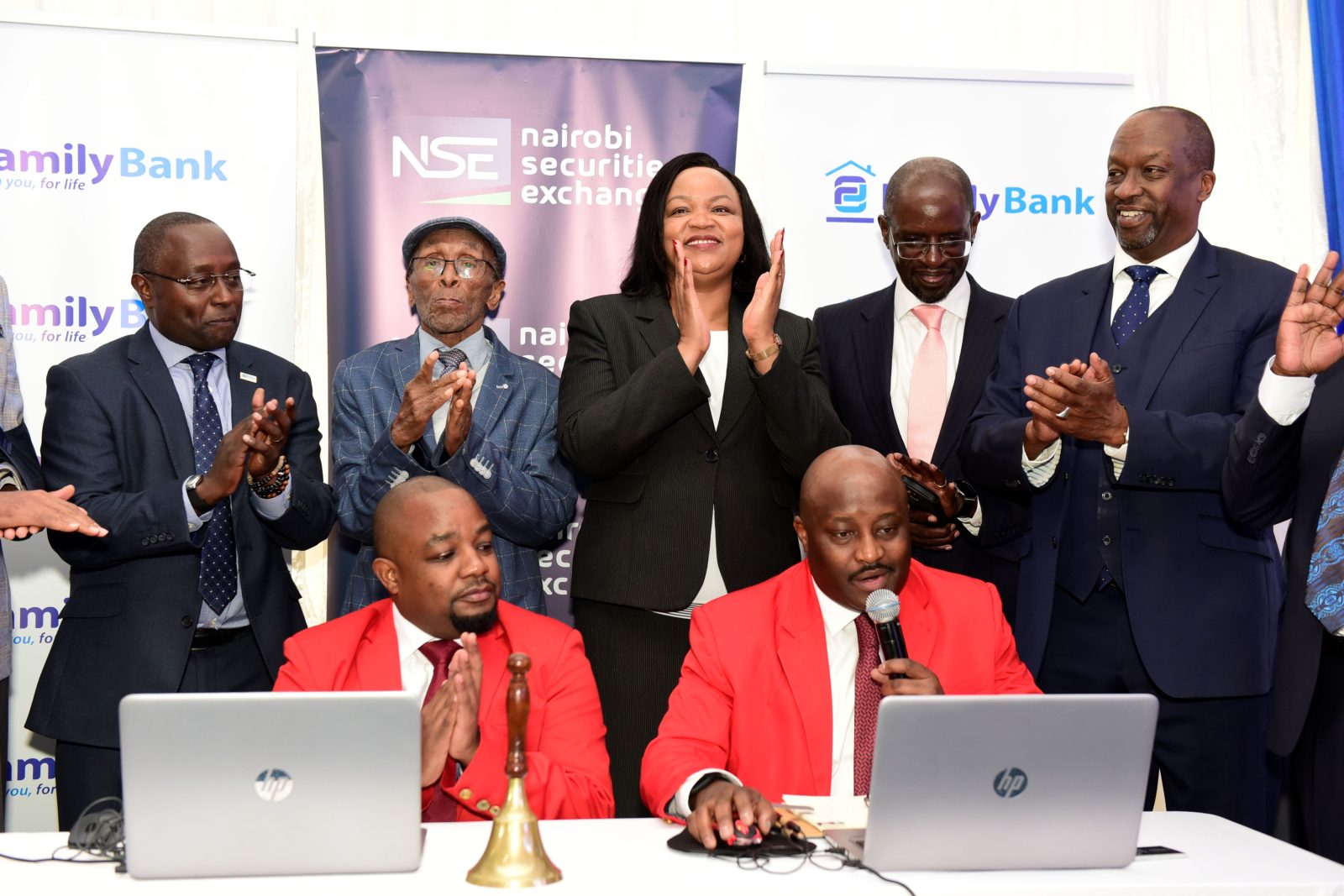 NSE CEO Frank Mwiti, Family Bank Founder T.K. Muya, CEO Nancy Njau, CBK Chair Andrew Musangi & NSE Chair Kiprono Kittony join Brian Mutunga & Tony Waweru during the listing of the bank’s shares