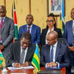 Energy and Petroleum Cabinet Secretary Opiyo Wandayi signs the deals in the company of his Rwandan counterpart Antoine Marie Kajangwe and other senior government officials.