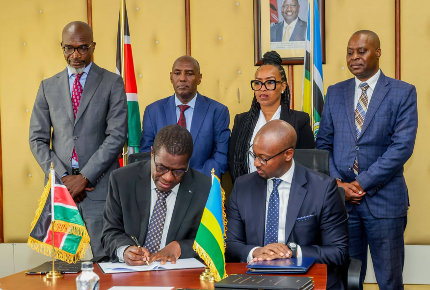 Energy and Petroleum Cabinet Secretary Opiyo Wandayi signs the deals in the company of his Rwandan counterpart Antoine Marie Kajangwe and other senior government officials.