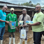 Pwani Oil Rift Region Regional Route-to-Market Assistant Manager Geoffrey Maina (right) joins his colleagues, Marketing Team Member James Katana (1st left) and South Rift Sales Executive Samuel Macharia (2nd left), in handing over Sawa Milking Jelly products to dairy farmers during a farmer engagement forum under the Sawa nationwide farmer empowerment initiative aimed at promoting improved udder care, mastitis prevention and enhanced milk quality among dairy farming communities.