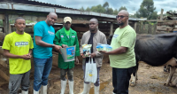 Pwani Oil Rift Region Regional Route-to-Market Assistant Manager Geoffrey Maina (right) joins his colleagues, Marketing Team Member James Katana (1st left) and South Rift Sales Executive Samuel Macharia (2nd left), in handing over Sawa Milking Jelly products to dairy farmers during a farmer engagement forum under the Sawa nationwide farmer empowerment initiative aimed at promoting improved udder care, mastitis prevention and enhanced milk quality among dairy farming communities.