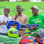 L-R: Bajaj Auto Regional Sales Manager Duke Akunga, Busia Boda Boda Chairman Boniface Okumu, and Mogo Regional Manager Sospeter Mwaura during the handover of a Bajaj motorcycle to the Busia Boda Boda Chairman.