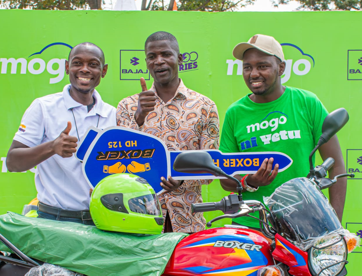 L-R: Bajaj Auto Regional Sales Manager Duke Akunga, Busia Boda Boda Chairman Boniface Okumu, and Mogo Regional Manager Sospeter Mwaura during the handover of a Bajaj motorcycle to the Busia Boda Boda Chairman.
