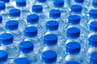 Blue-capped water bottles in grid pattern