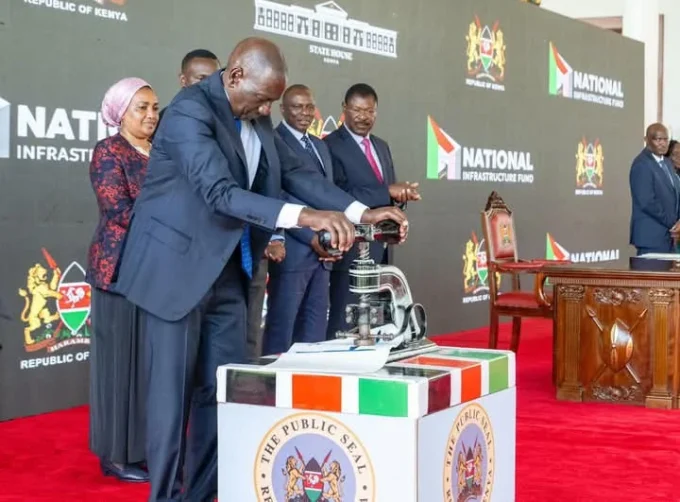 President William Ruto while signing the National Infrastructure Fund Bill into law