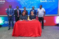 Jubilee Health Insurance CEO Njeri Jomo(seated left) and Boltech Africa General Manager Bente Krogmann during the partnership signing deal as other officials look on.