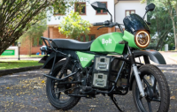 A bolt bike parked by the road side.