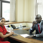 Ngao Credit Acting Chief Commercial Officer Gilbert Tochi takes SME owner Maureen David through the Jijenge 90-Day Supplier Loan at Ngao Credit’s head offices.