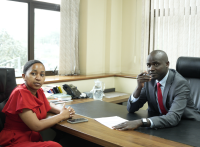 Ngao Credit Acting Chief Commercial Officer Gilbert Tochi takes SME owner Maureen David through the Jijenge 90-Day Supplier Loan at Ngao Credit’s head offices.
