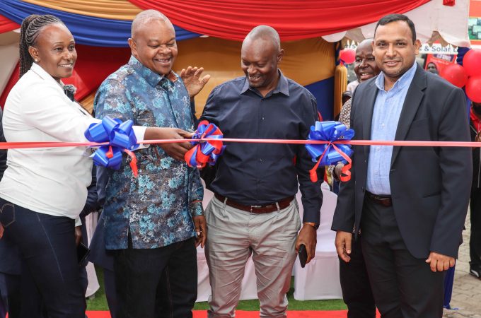 From left: Mary and Joseph Waigwa, Directors, Paints and Hardware, cut the ribbon to open Crown Paints’ new Xperience Centre in Mlolongo, Machakos County, as Group CEO Mustafa Turra looks on.