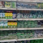 Milk on display in supermarket shelves