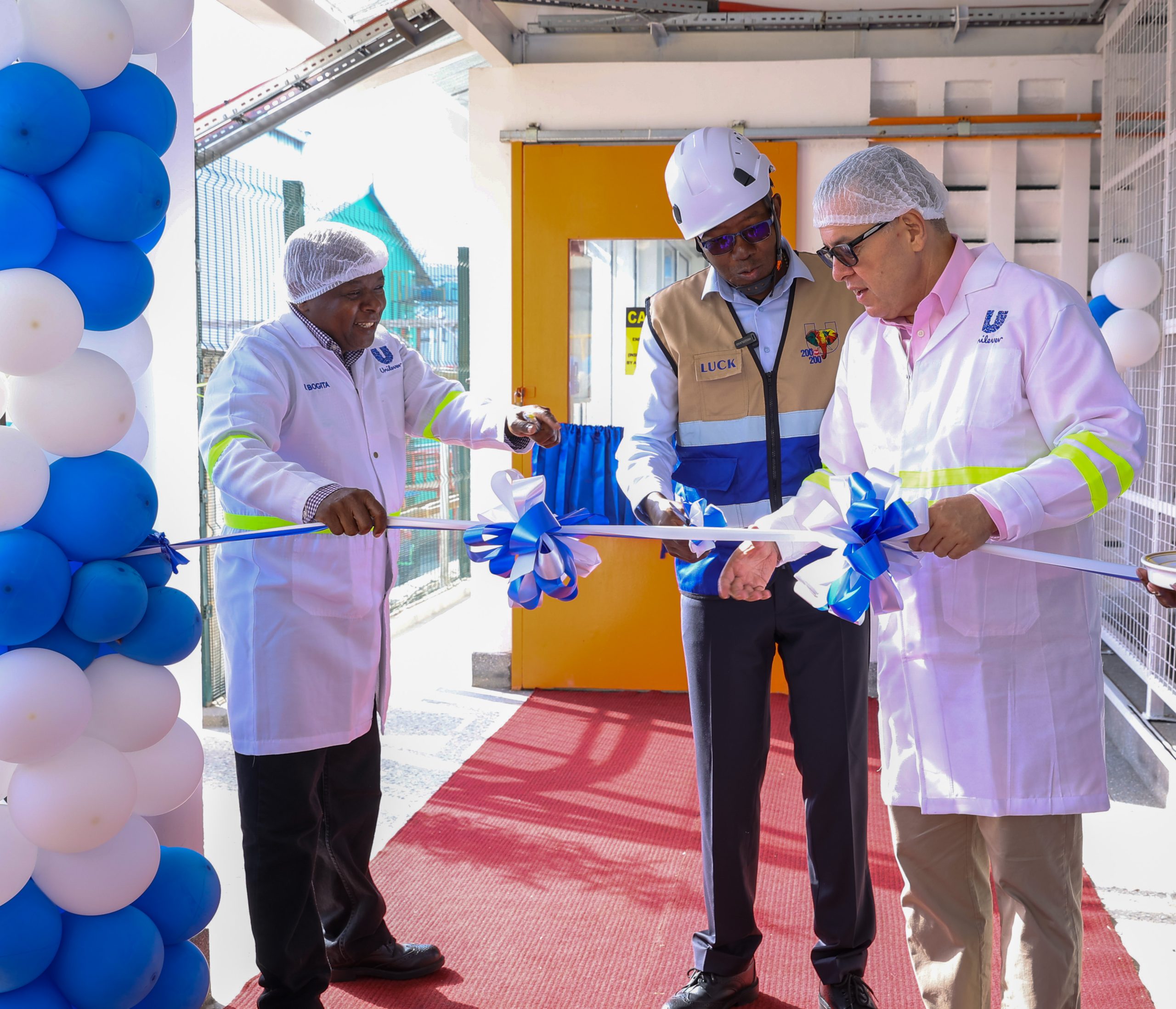 Richard Bogita, Supply Chain Director, Unilever East & West Africa; Luck Ochieng, Managing Director, Unilever East Africa; and João F. Ribeiro, Unilever’s 1UL Supply Chain Head, unveil the company’s new 800kW solar installation at its Nairobi factory. 