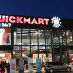 A quickmart outlet during the night.