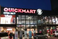 A quickmart outlet during the night.