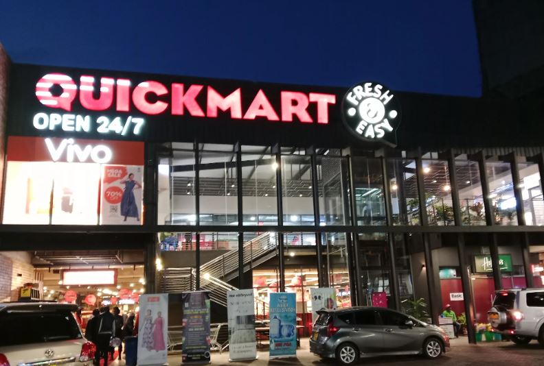 A quickmart outlet during the night.